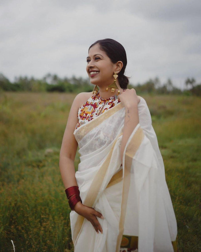 estival Saree in White Soft Linen Silk With Wooven Pallu and Blouse
