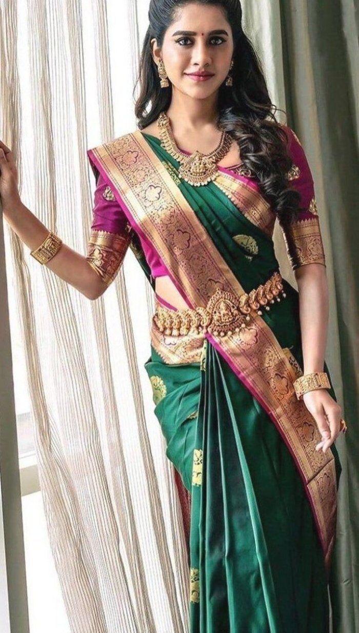 Extravagant green soft silk saree with a classy blouse piece