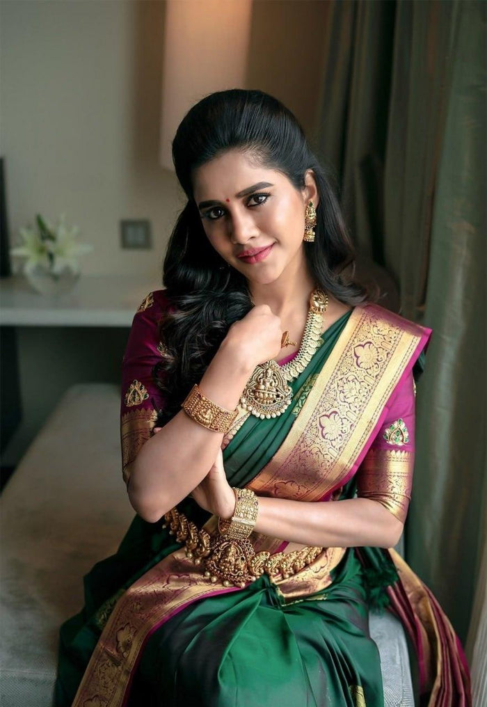 Extravagant green soft silk saree with a classy blouse piece