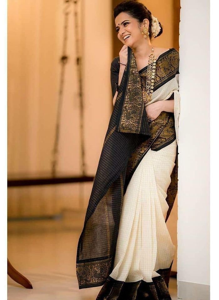 White Colour Soft lichi Silk Golden And Golden Jari With Heavy Jaquard Border