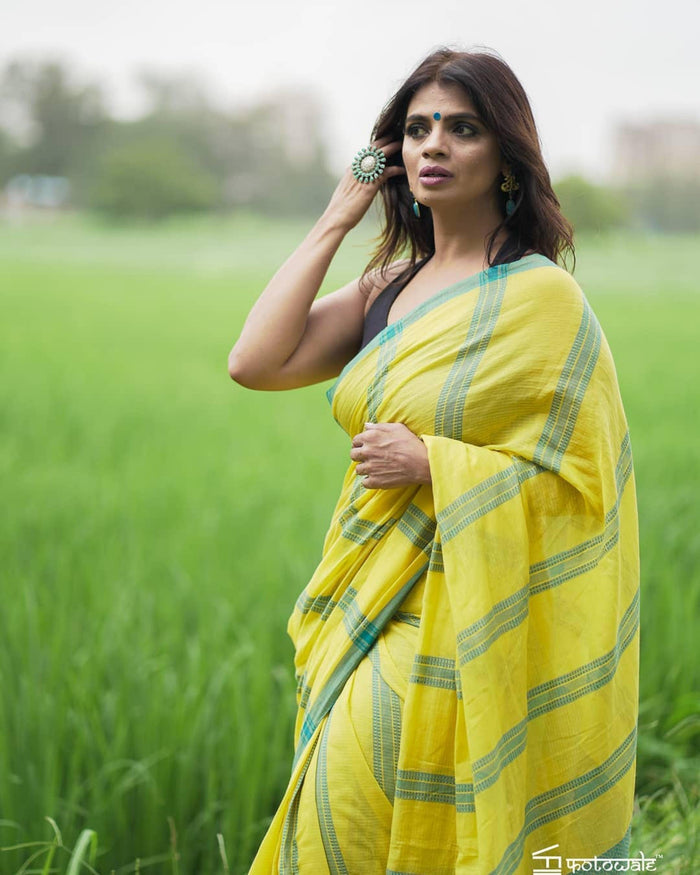 Adorning Yellow color Linen Designer Embroidered Saree